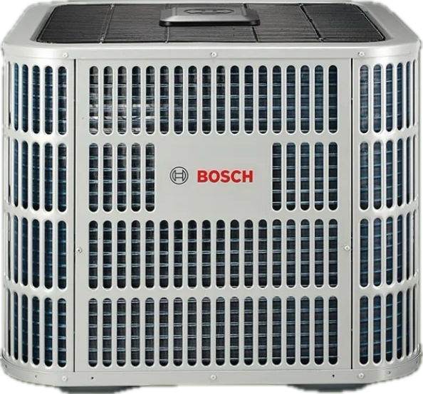 Woman in straw hat smiles, holding wine glass near a lake.