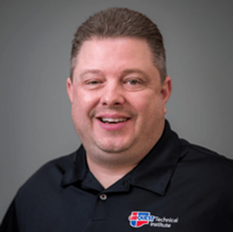 A man wearing a black shirt with the word technical on it