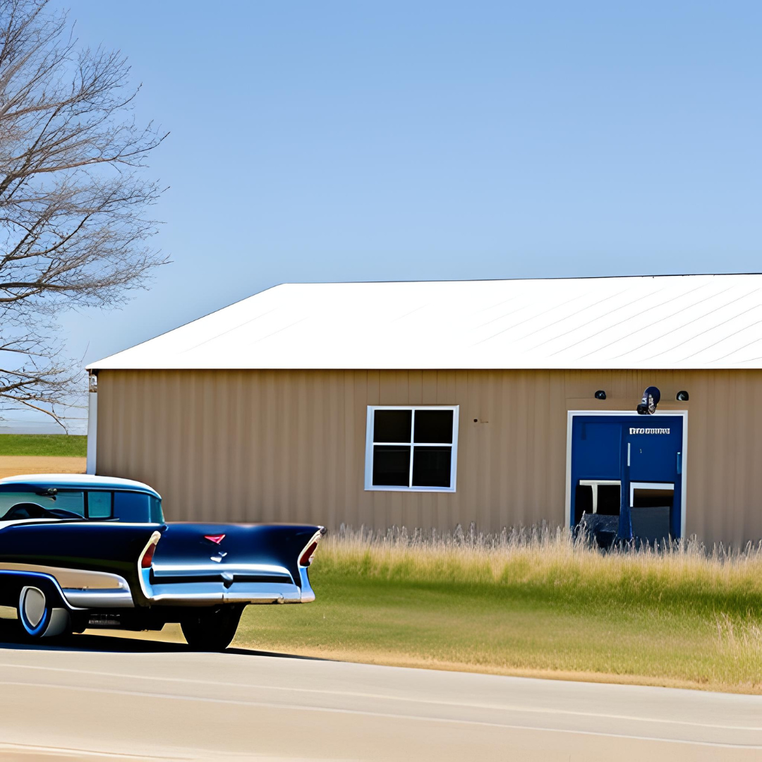 A blue car is parked in front of a tan building