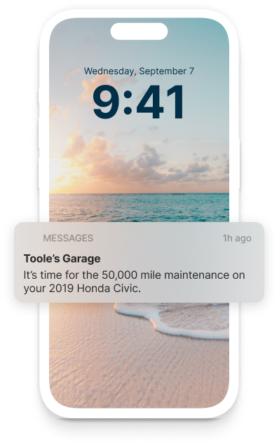 A phone displays a message from tools garage