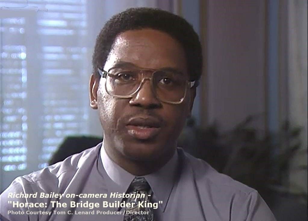 A picture of a mountain in a frame on a gray background.