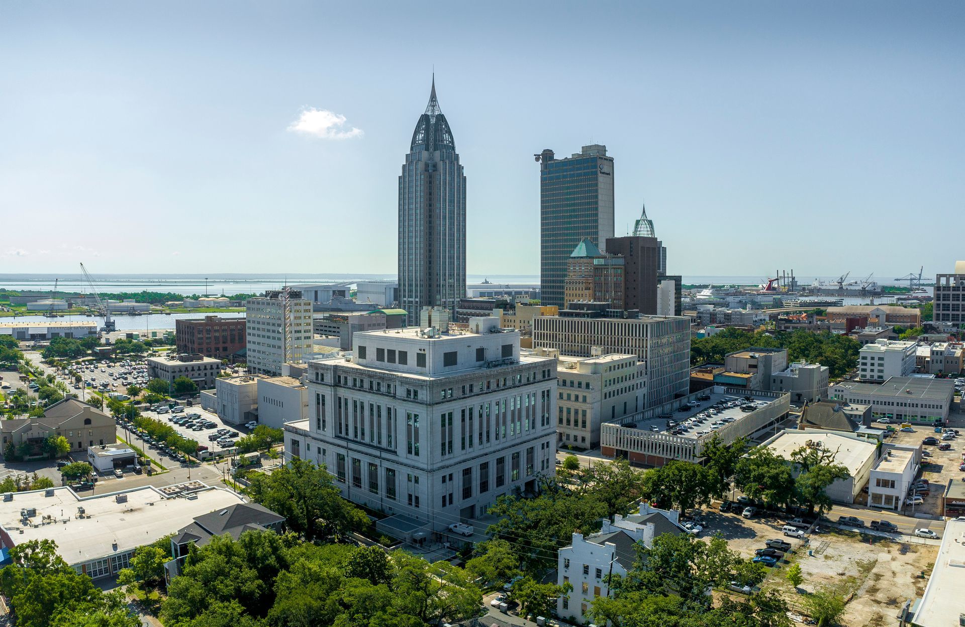 An aerial view of a city with lots of buildings and trees.