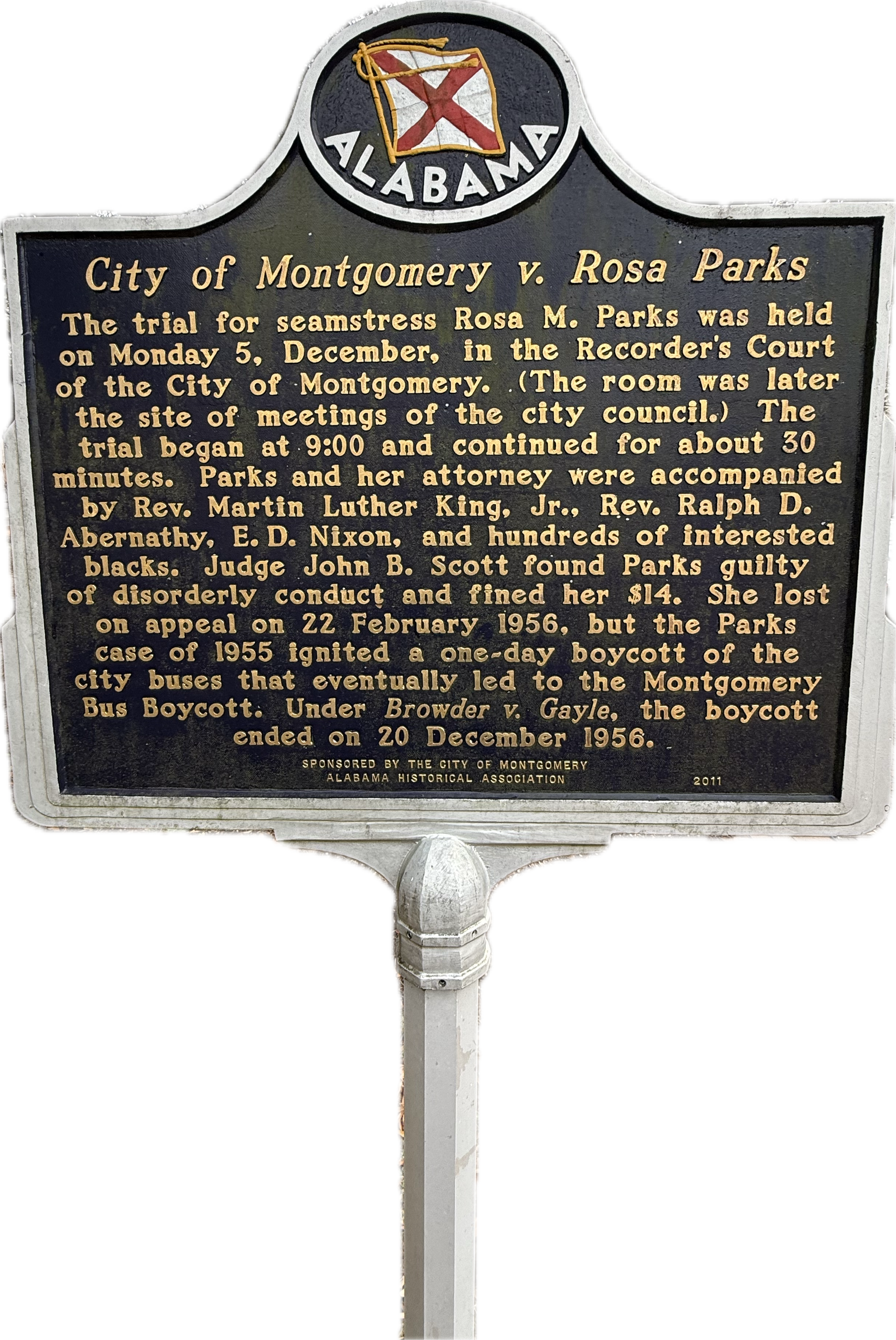 A city street with a large building in the background.