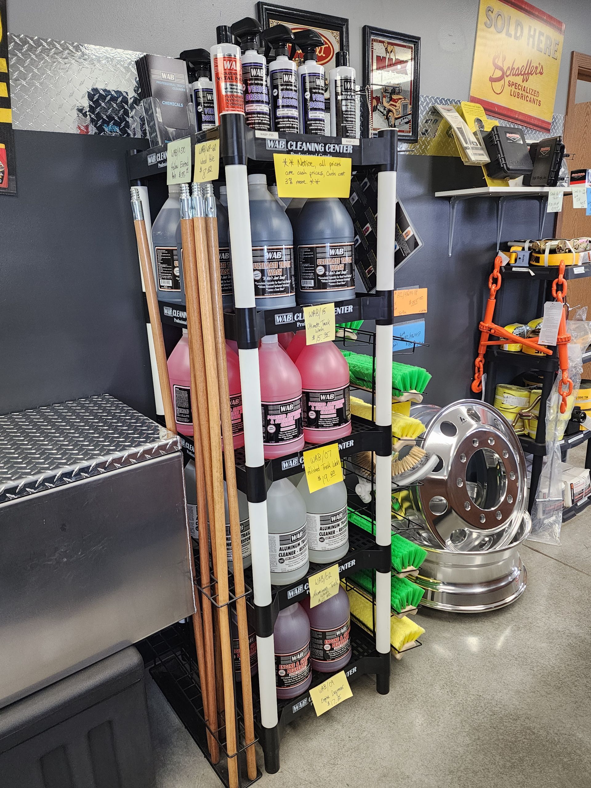 A rack filled with bottles and sticks in a store.