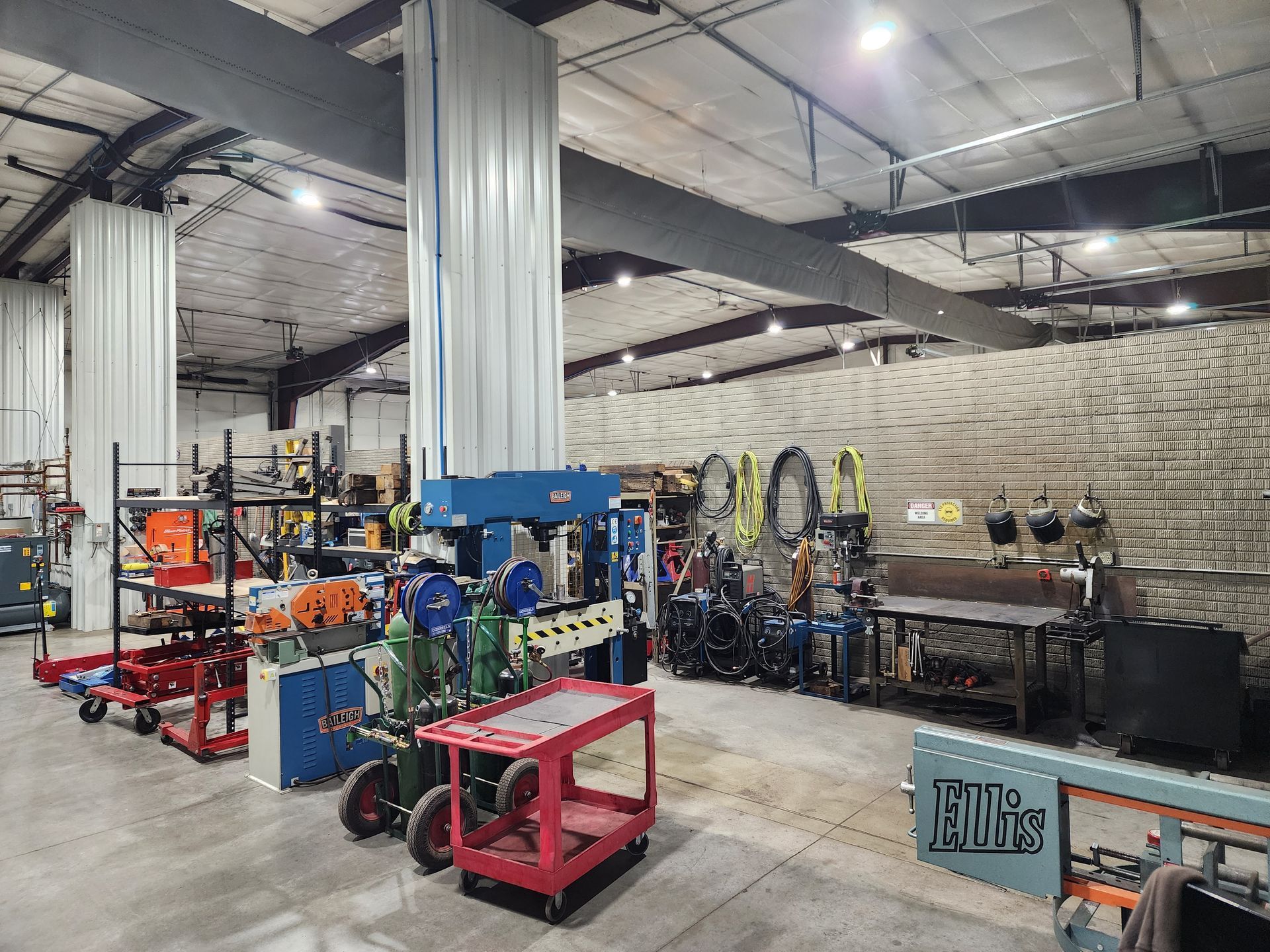 A large warehouse filled with lots of machinery and tools.