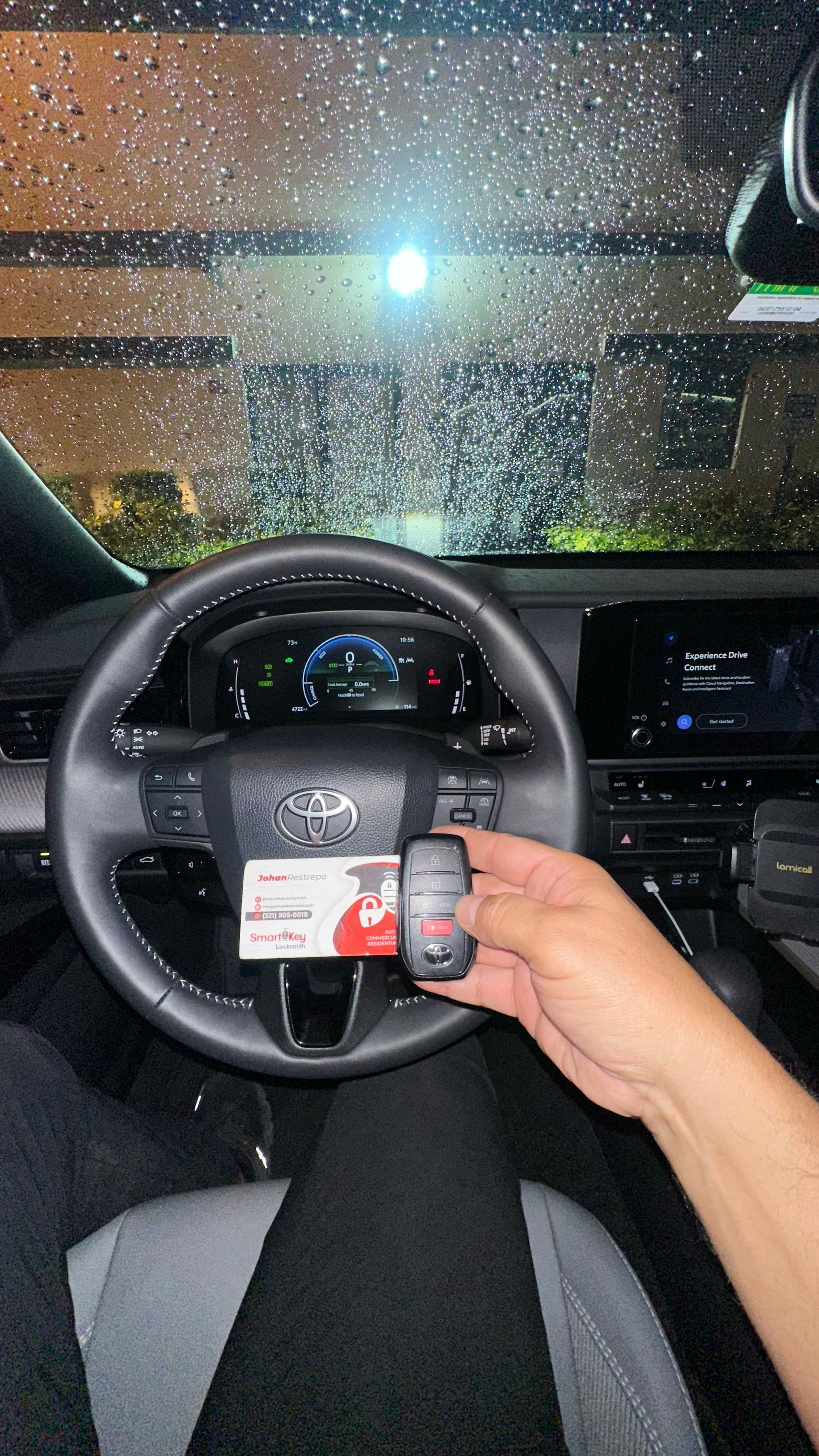 A person is fixing a door with a screwdriver and a drill.