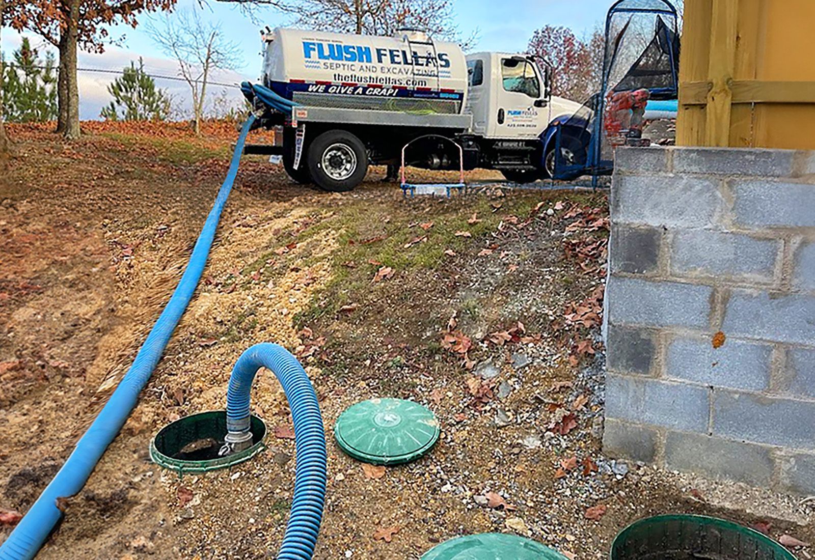 septic tank pump truck performing maintenance