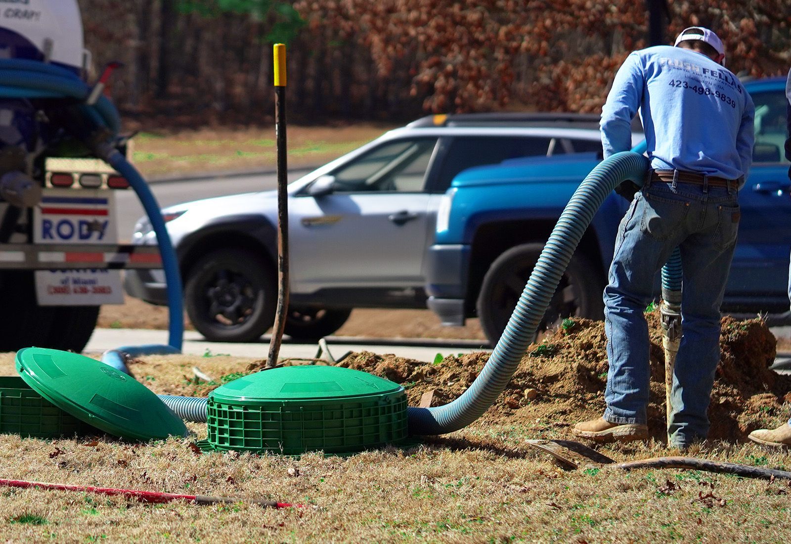 an employee performing emergency weekend service on a septic tank