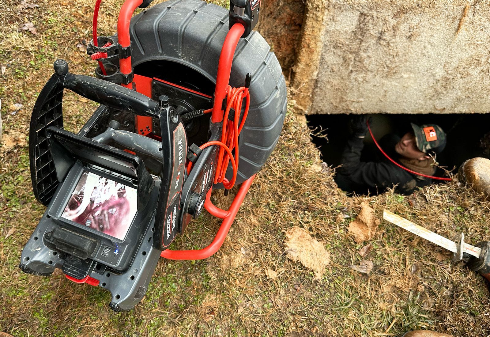 a camera snaking out a clogged septic system