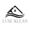 Logo for Luxe Klean cleaning service. Features a stylized house with a squeegee above the roof and two wavy lines below, with the company name.