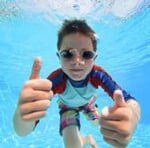 Child taking picture under water — Pool Cleaning service in Spring Hill, FL