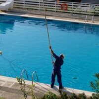 man cleaning pool —  Pool installation in Spring Hill, FL