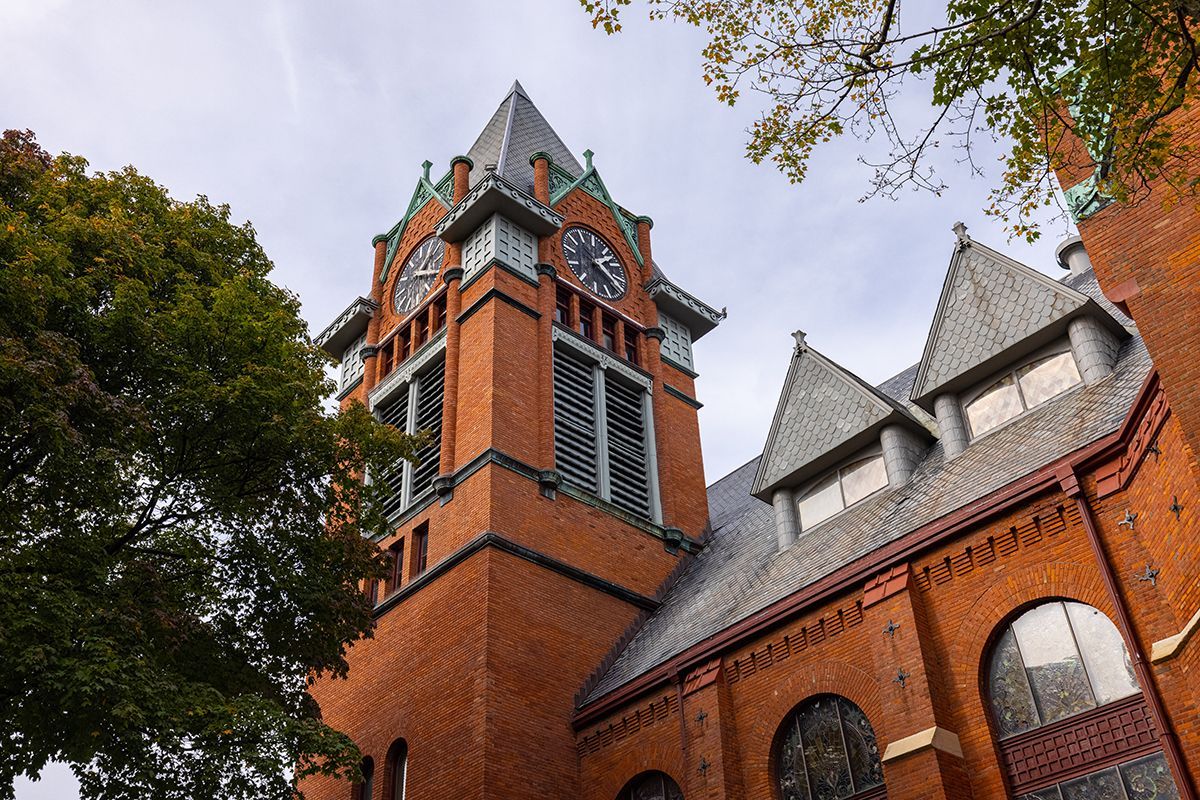 A large brick building with a clock tower on top of it
