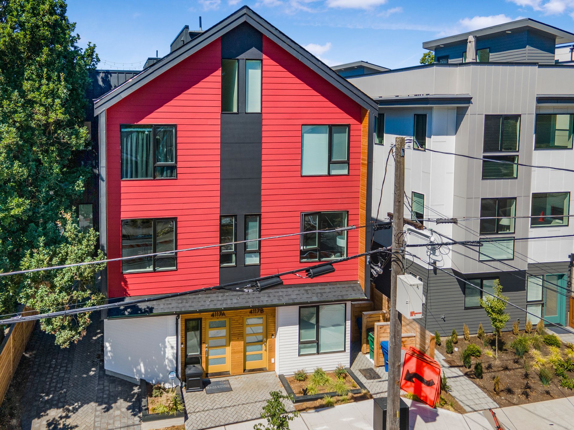 An aerial view of a red building with a lot of windows