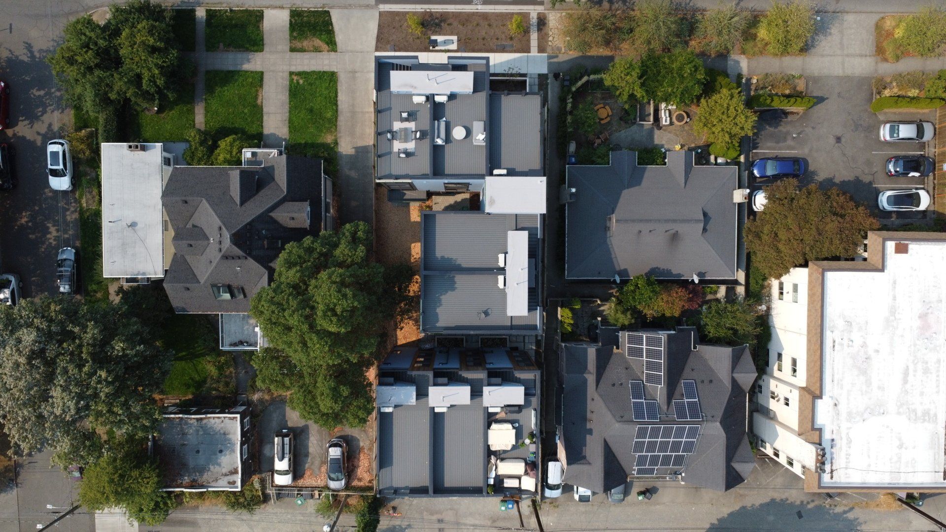 An aerial view of a residential area with lots of houses and trees