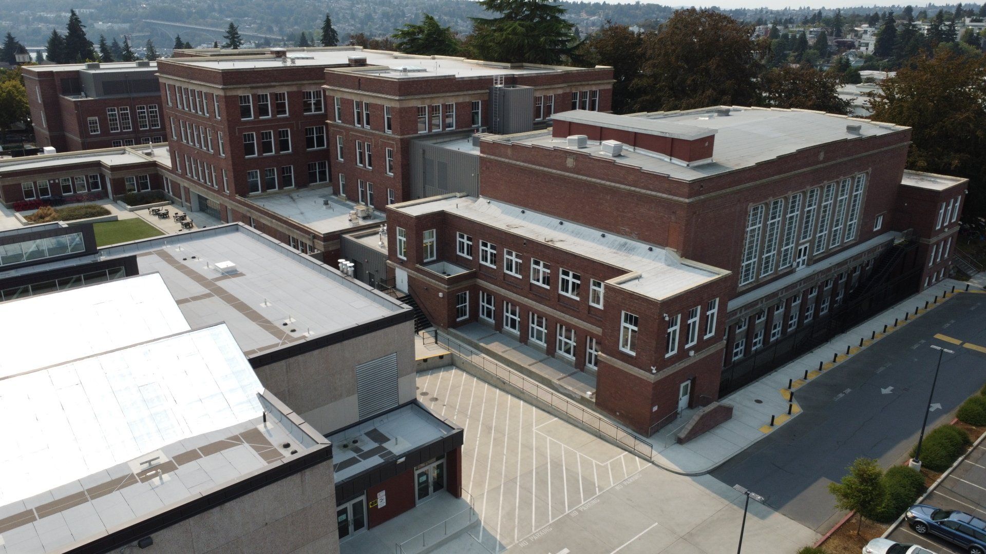 An aerial view of a large brick building with a lot of windows