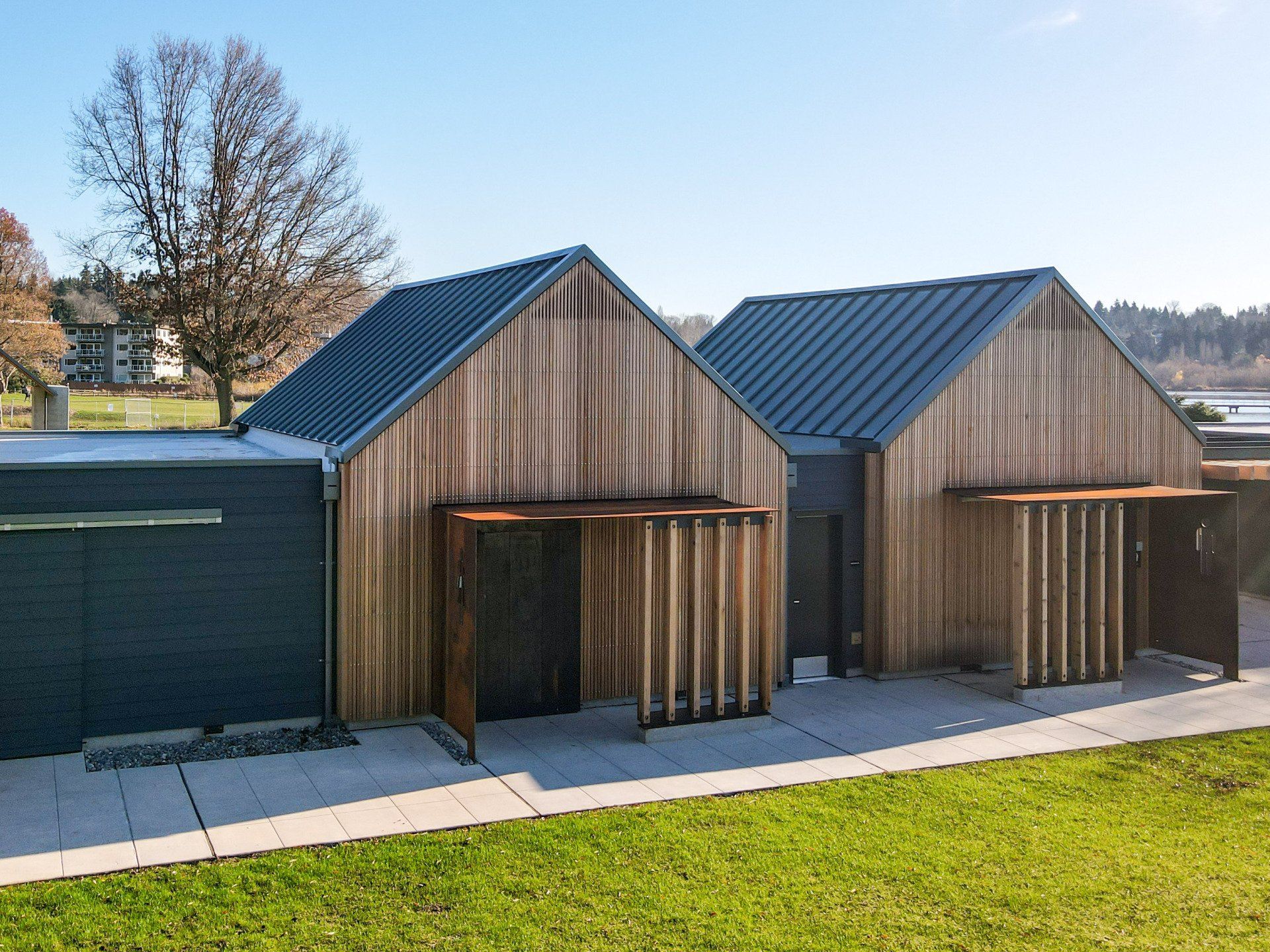 A row of wooden houses with a metal roof