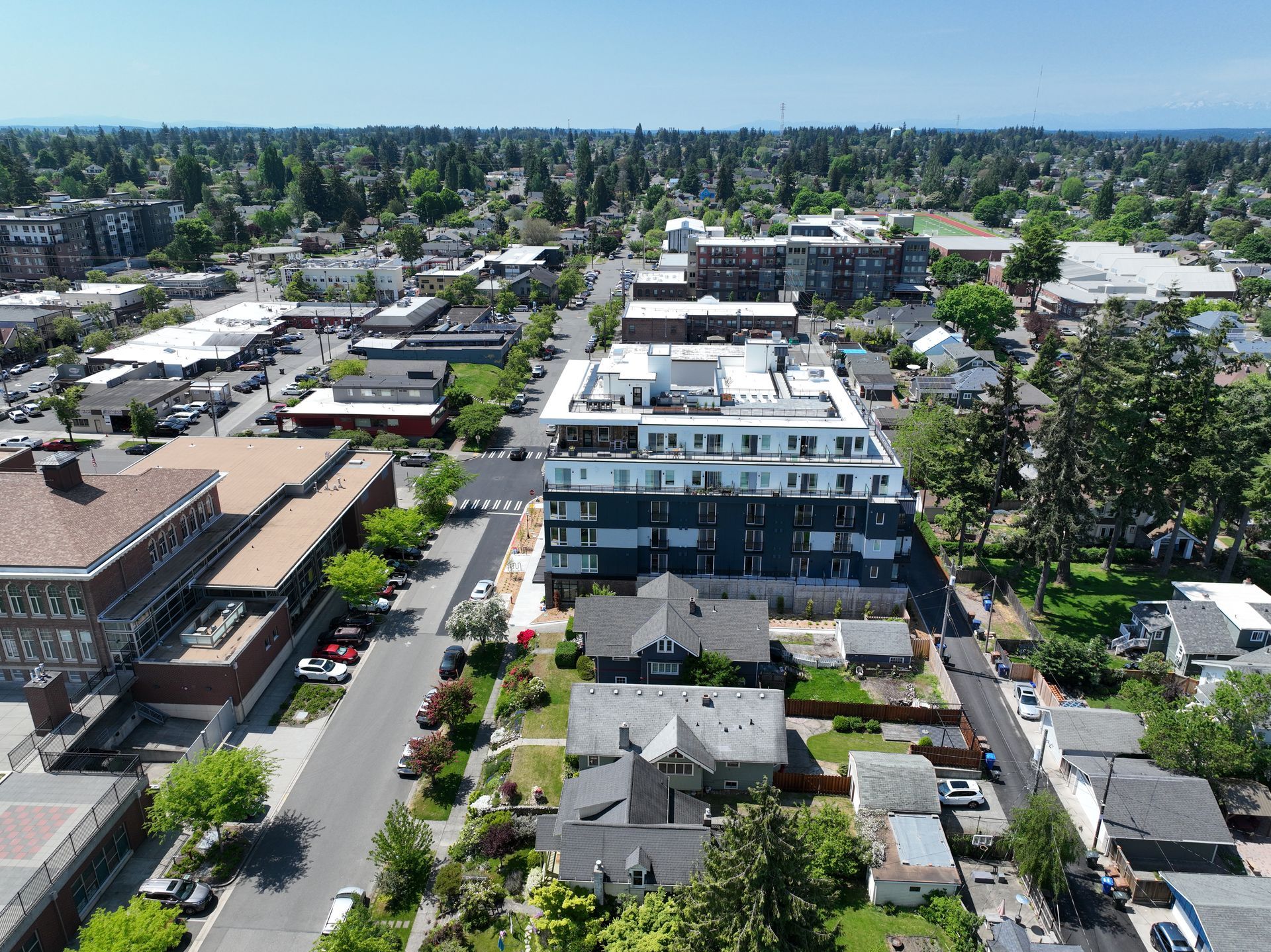 An aerial view of a city with lots of buildings and trees