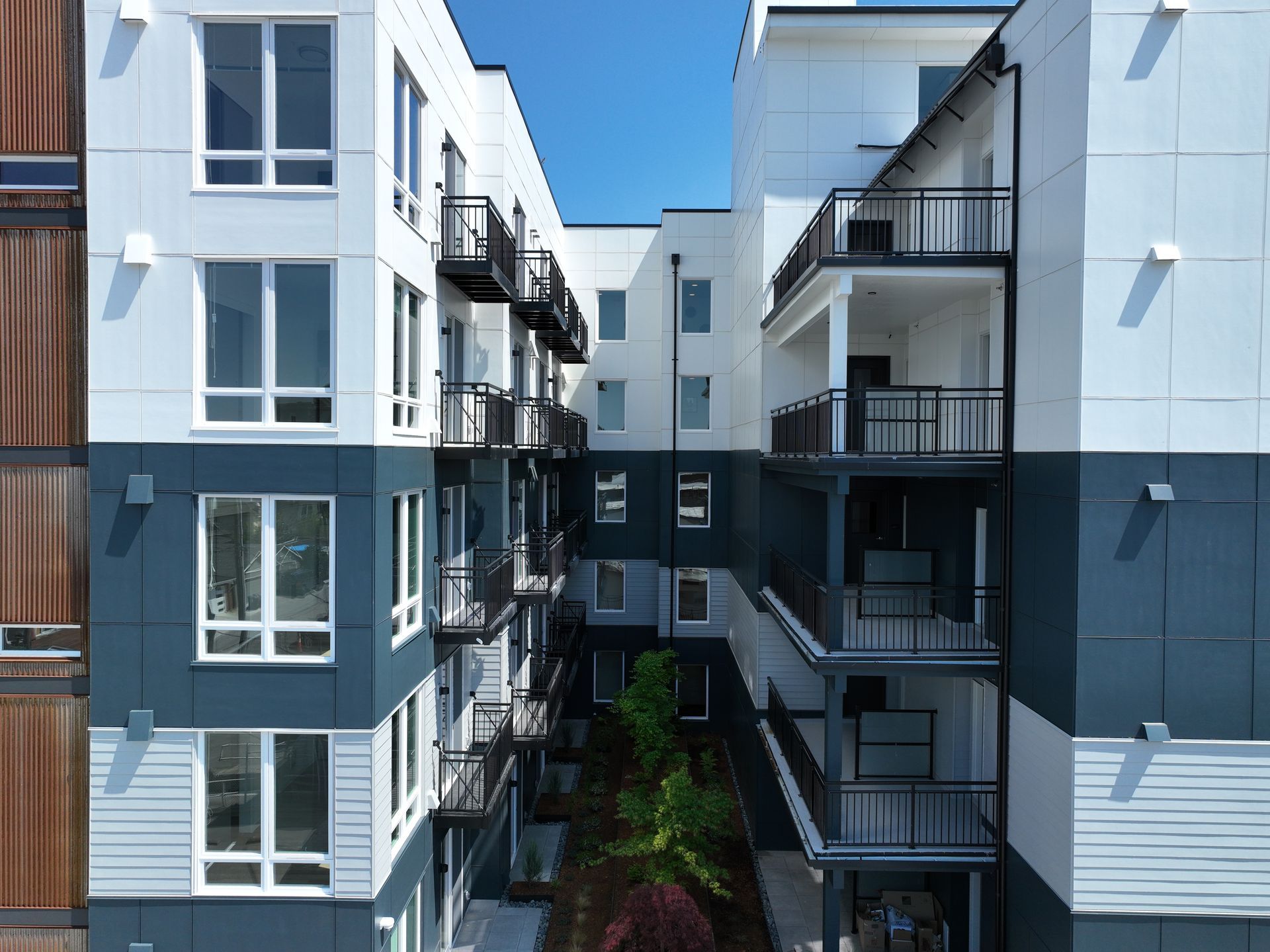 A large apartment building with a lot of windows and balconies