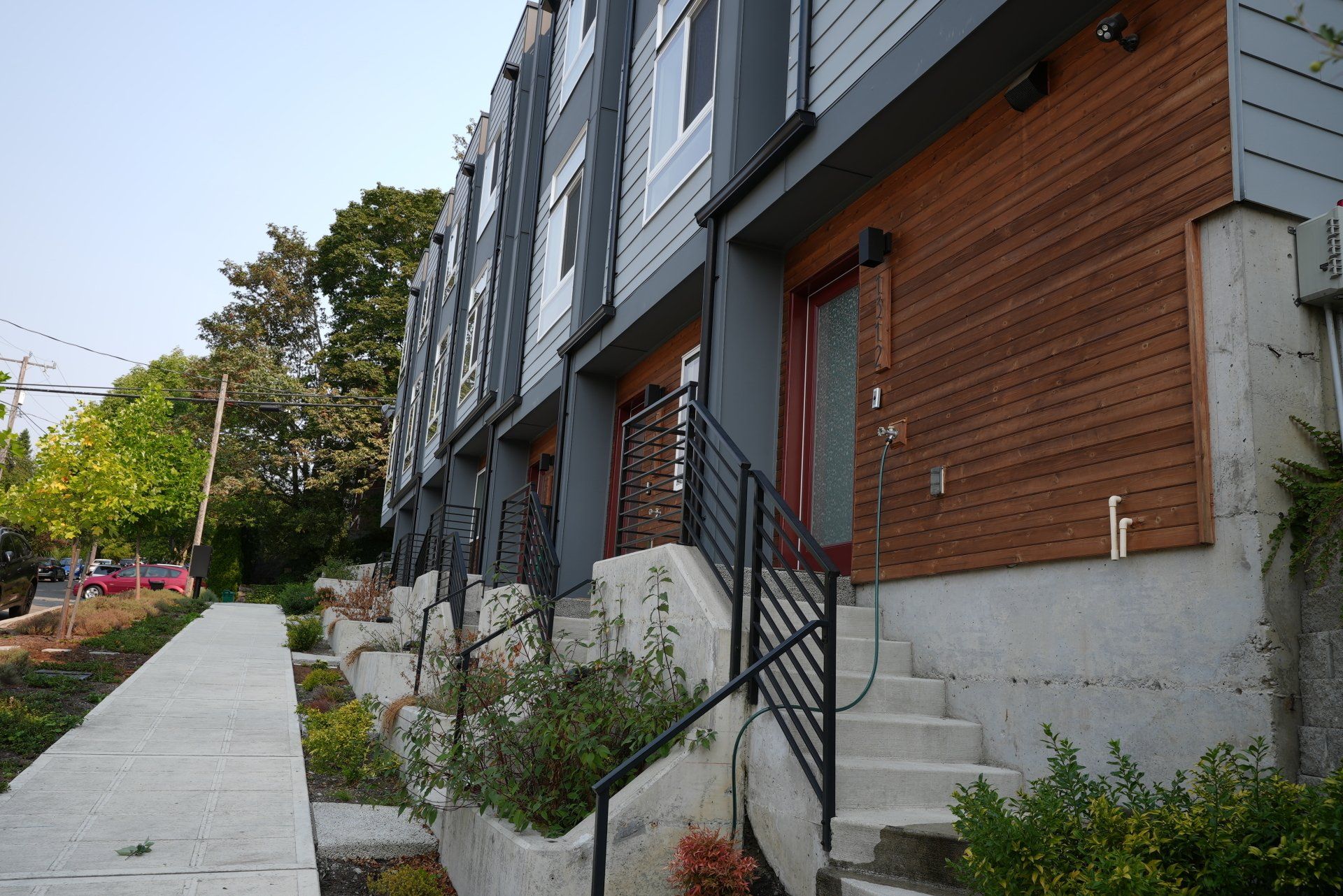 A row of apartment buildings with stairs leading up to them