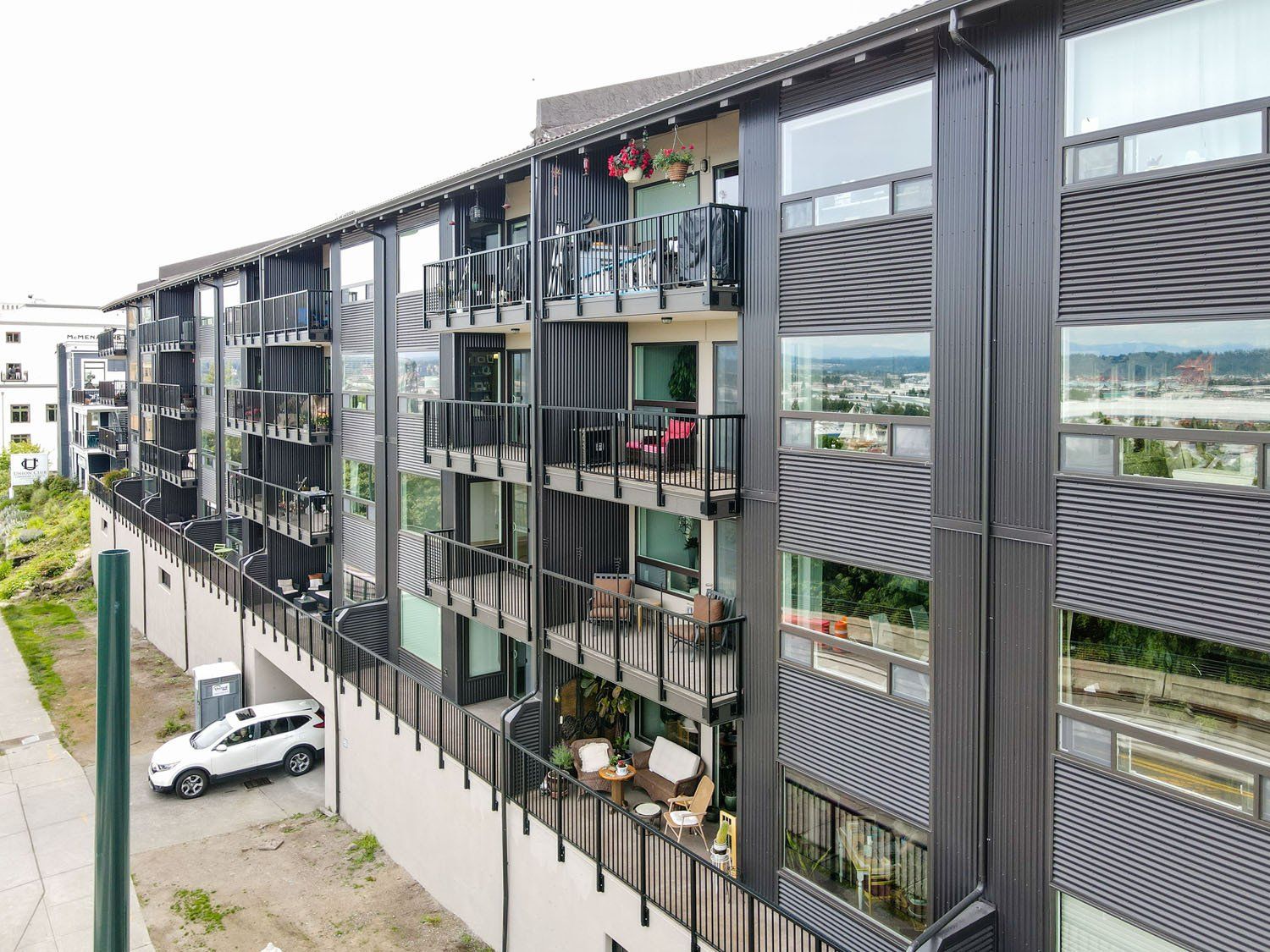 A large apartment building with a lot of windows and balconies.