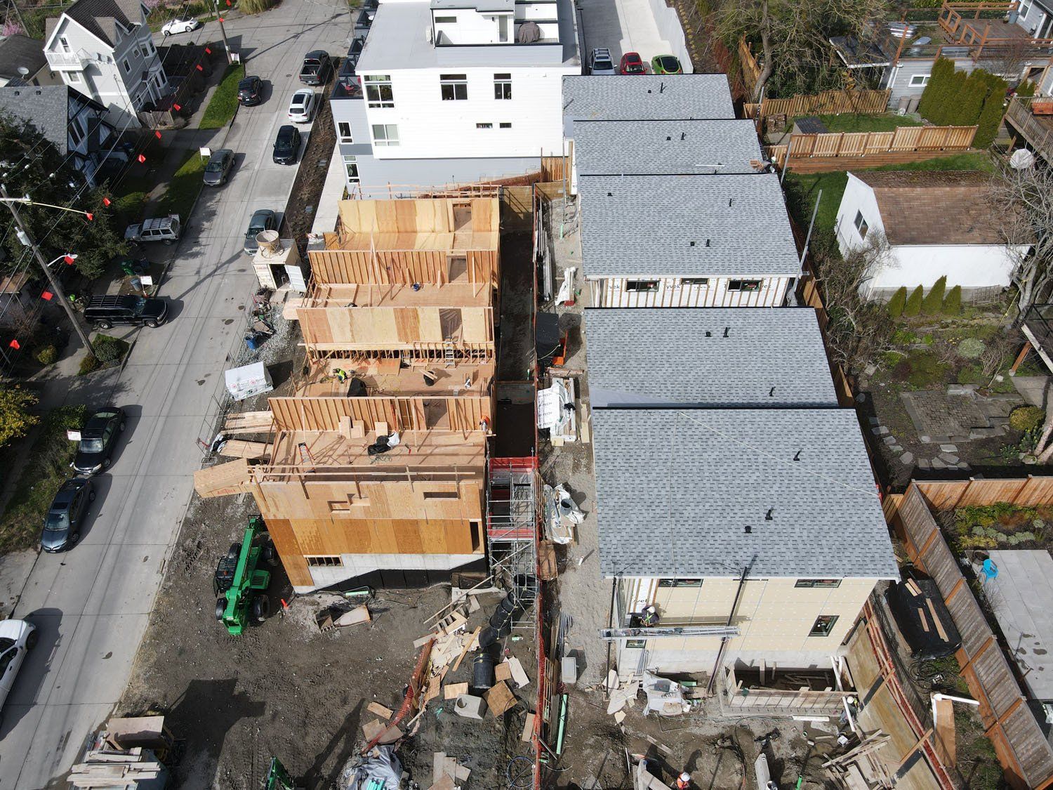 An aerial view of a row of houses under construction