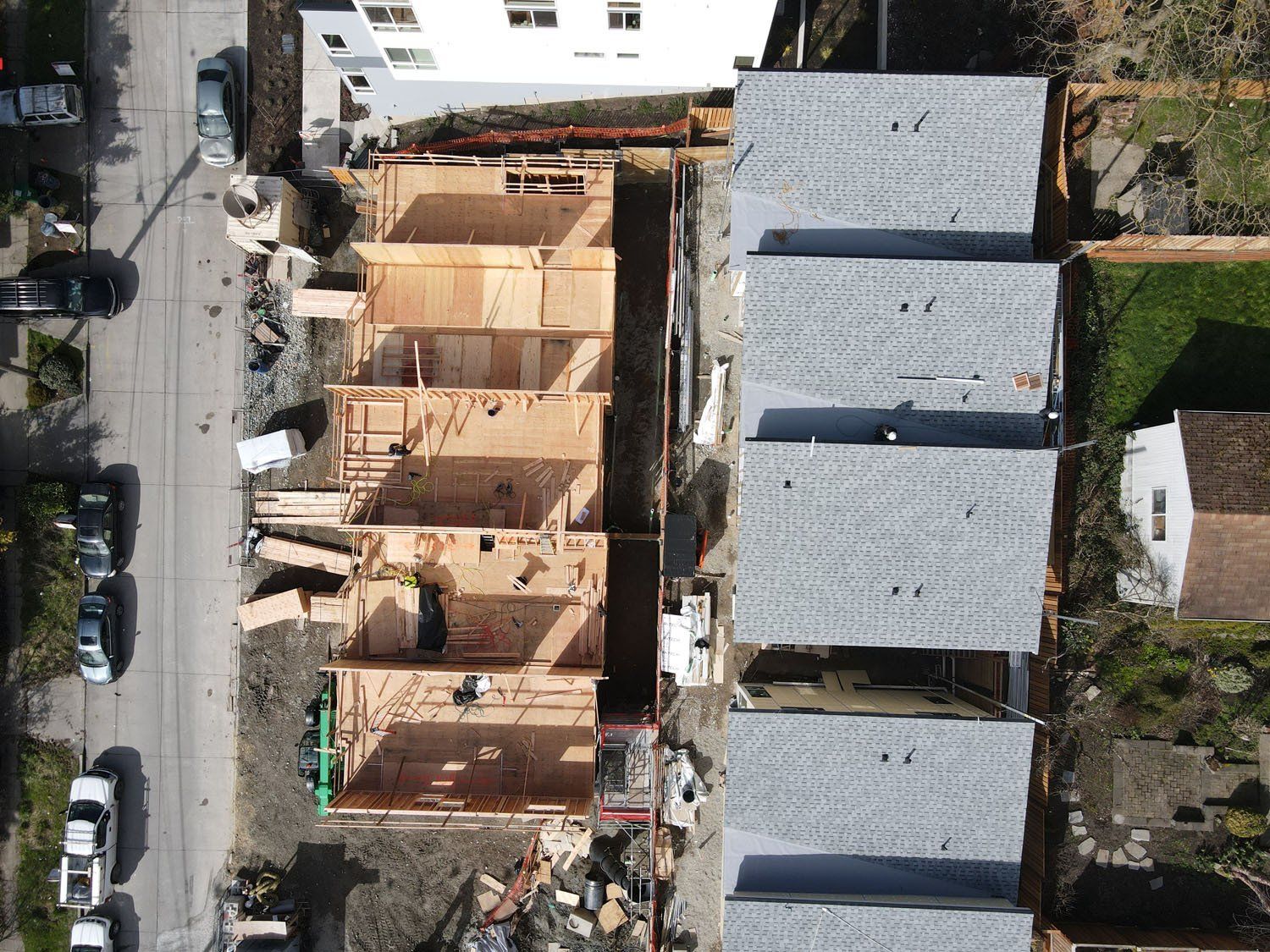 An aerial view of a row of houses under construction