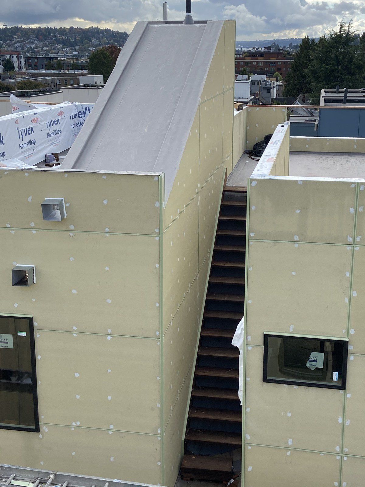 A staircase leading up to the roof of a building