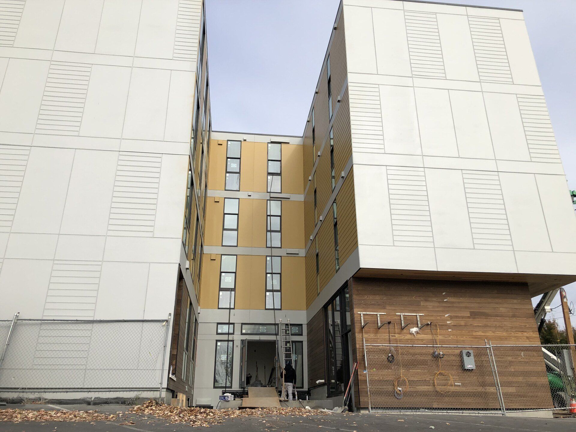 A large building with a lot of windows is being built