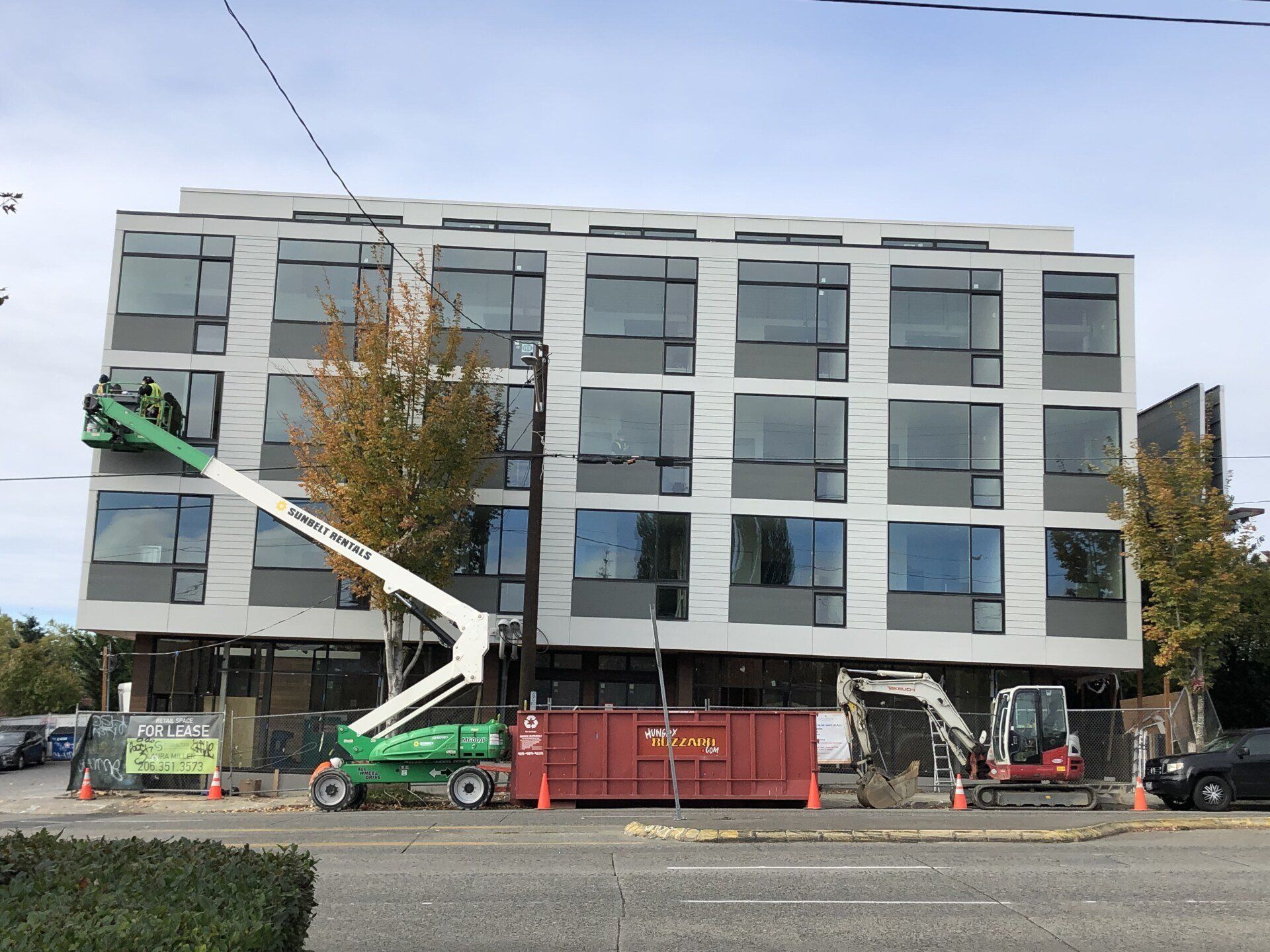 A large building with a lot of windows is being built.