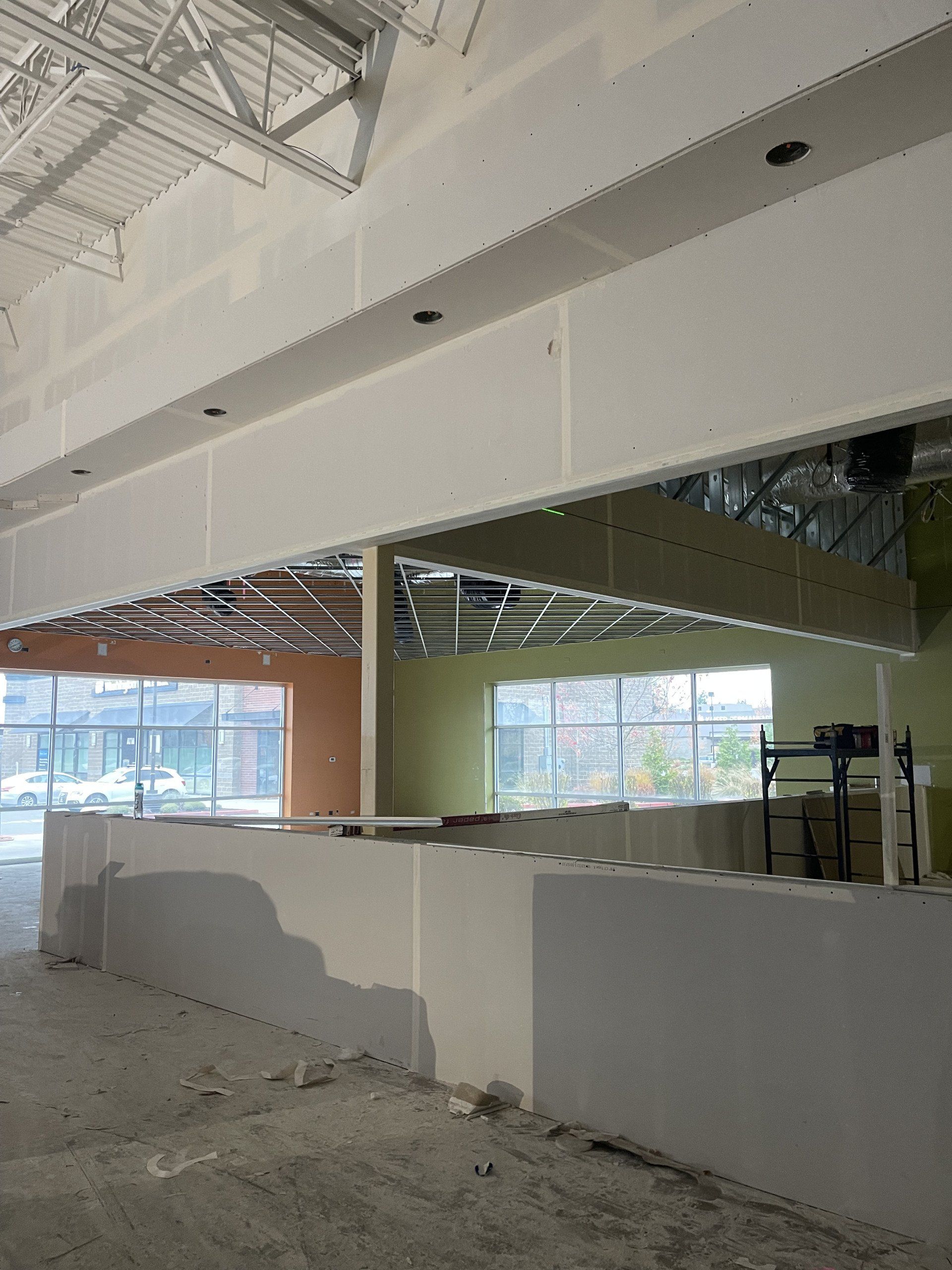 A building under construction with a lot of windows and a ceiling.