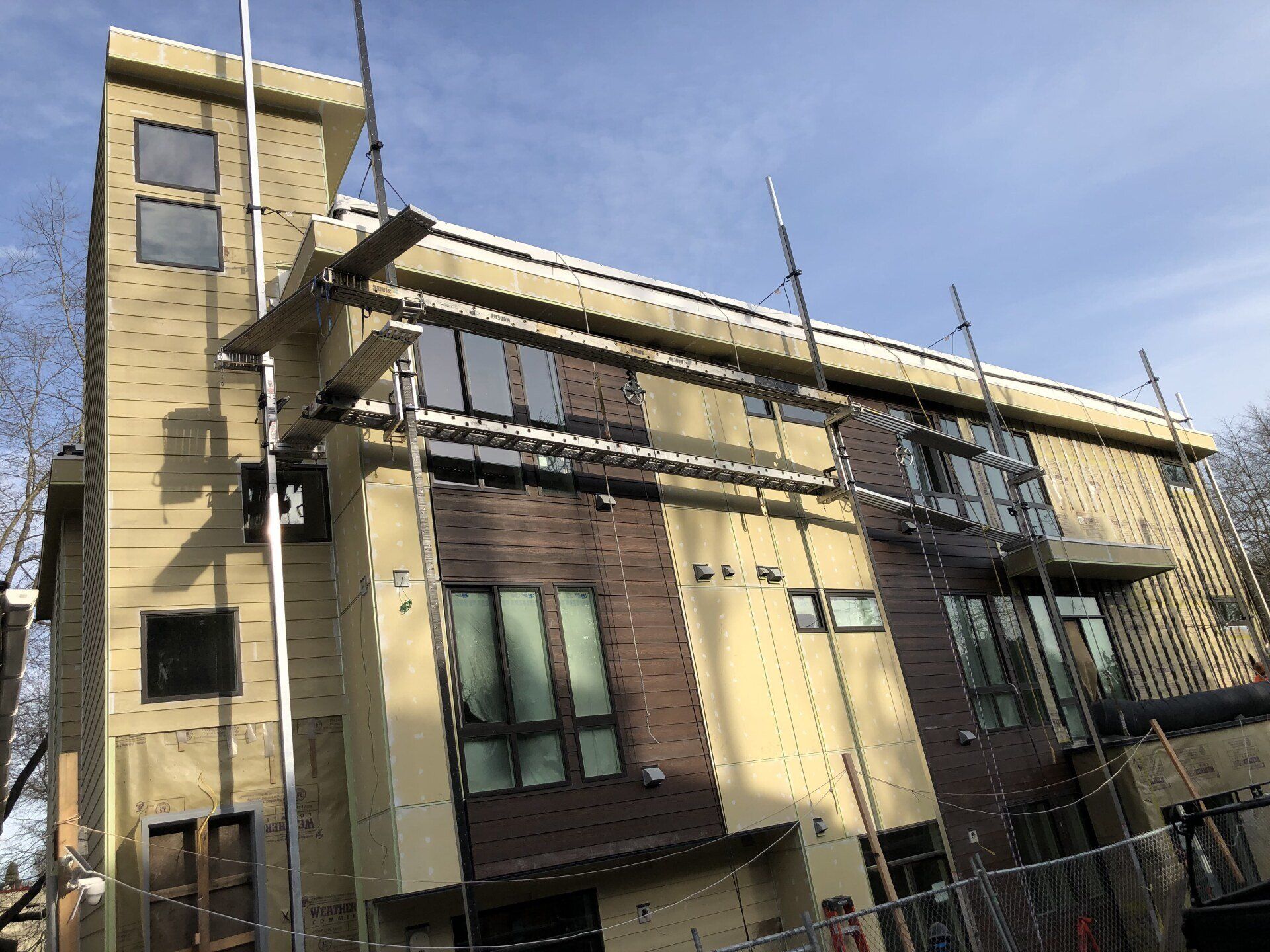 A large building under construction with scaffolding on the side of it.