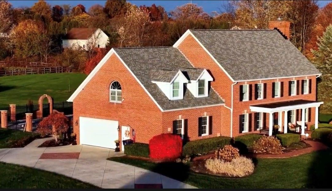 Roofing — Two-Storey House With Shingles in Columbus, OH