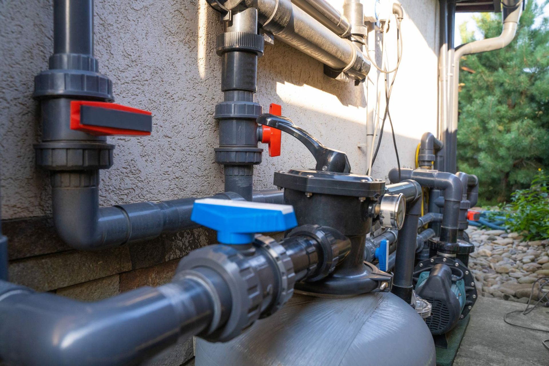 Outdoor plumbing system with valves and pipes used for pump installation and repair service