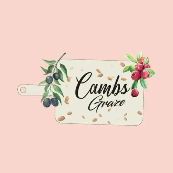 The logo for cambs graze is a cutting board with berries and olives on it.