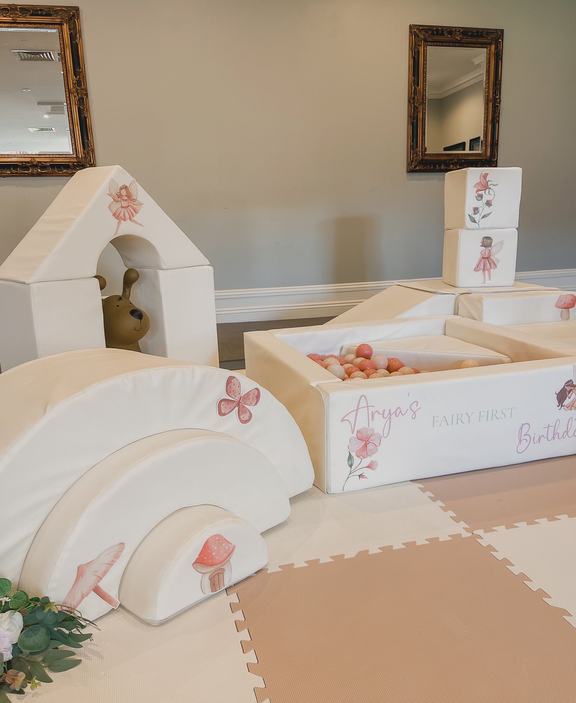 A room with a lot of white toys on the floor