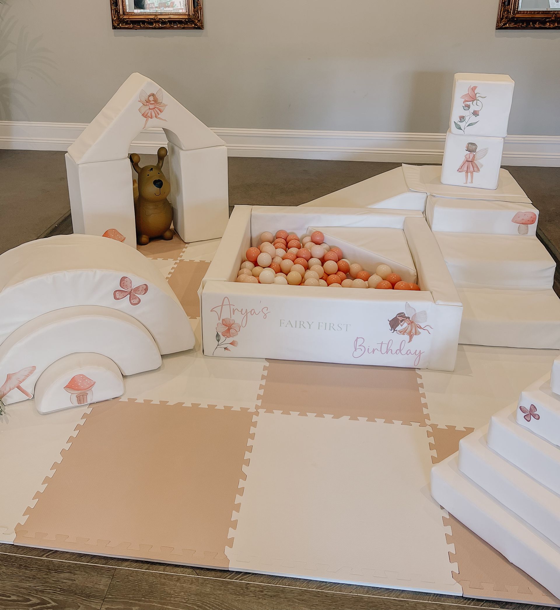 A room filled with lots of toys including a dog house