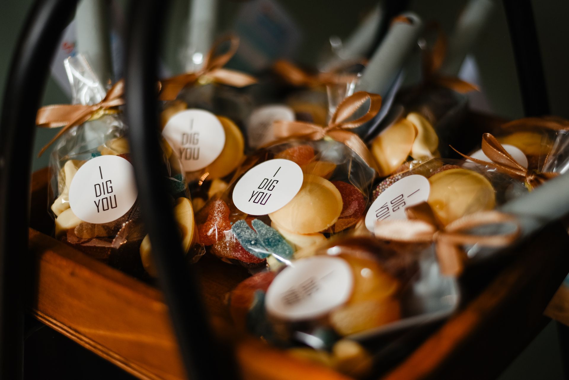 A basket filled with fortune cookies and candy on a table.