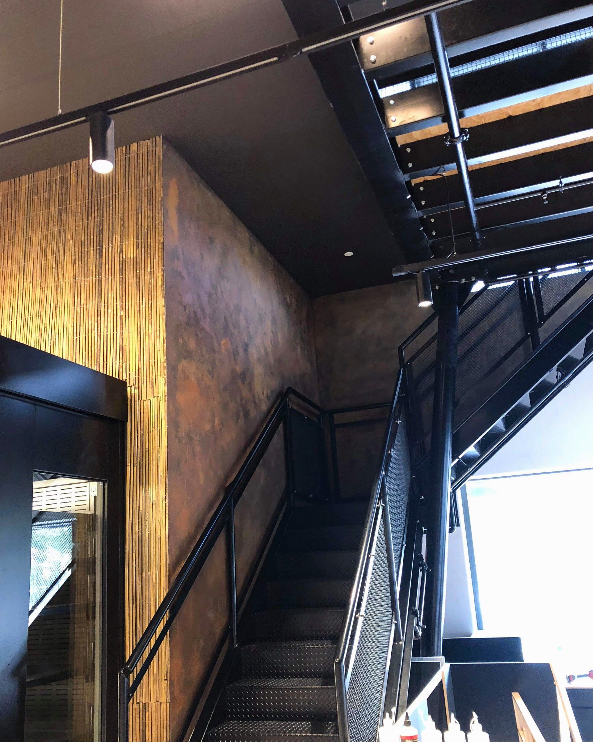 copper design effect paint on cafe stairwell wall painted by ABC Paint & Deco