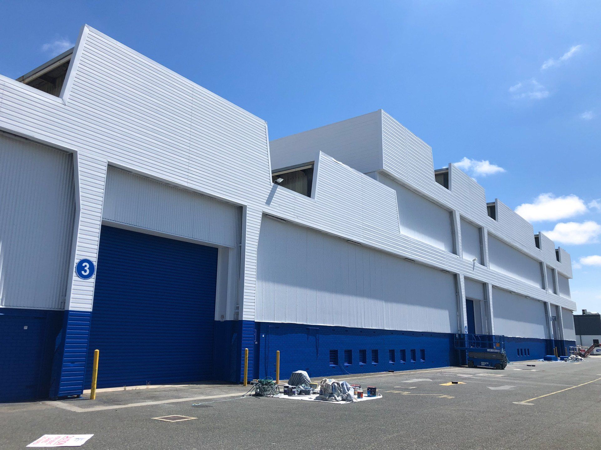 huge blue and white wharehouse painted by ABC Paint & Deco
