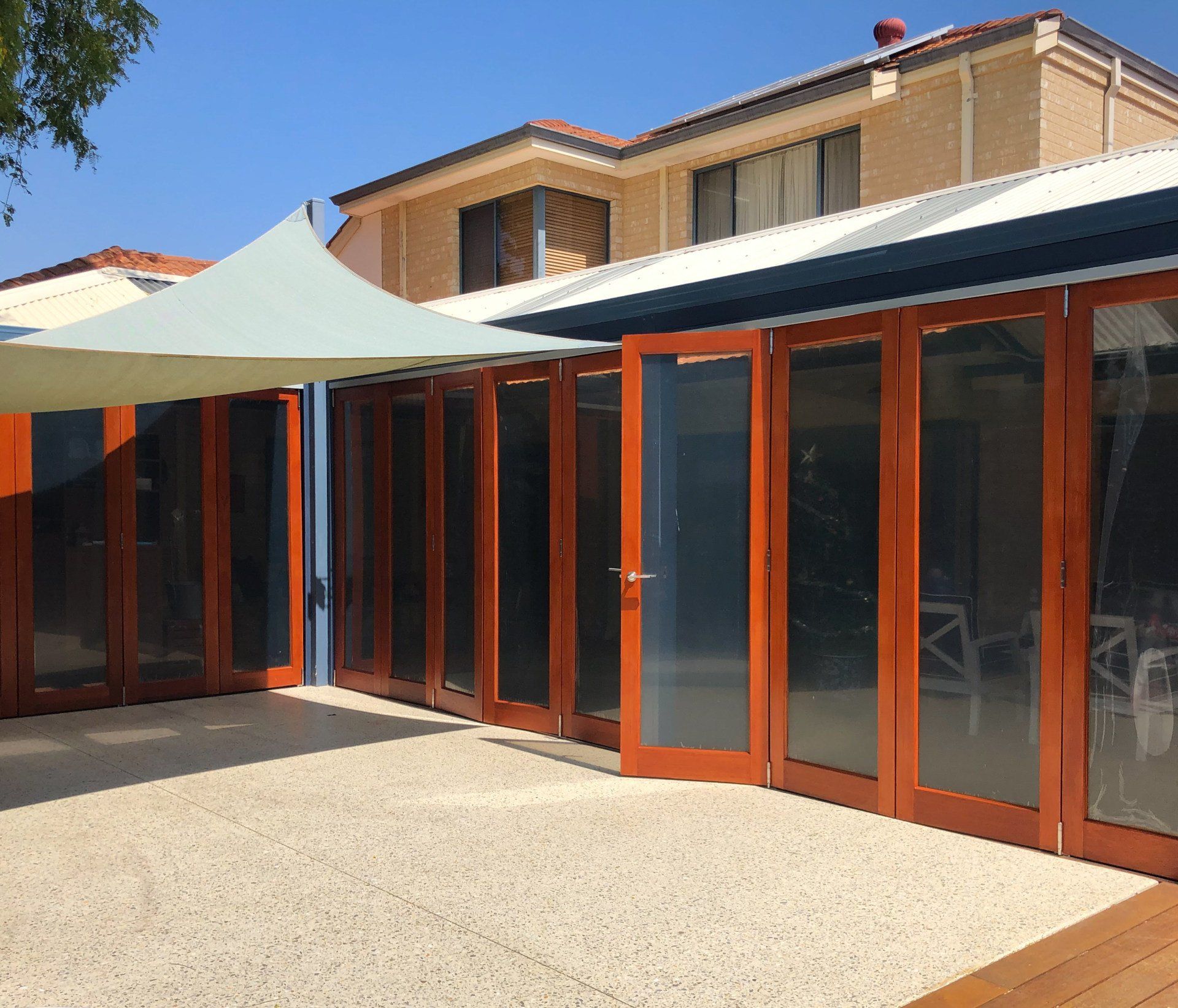 patio bi-fold doors varnished by ABC Paint & Deco