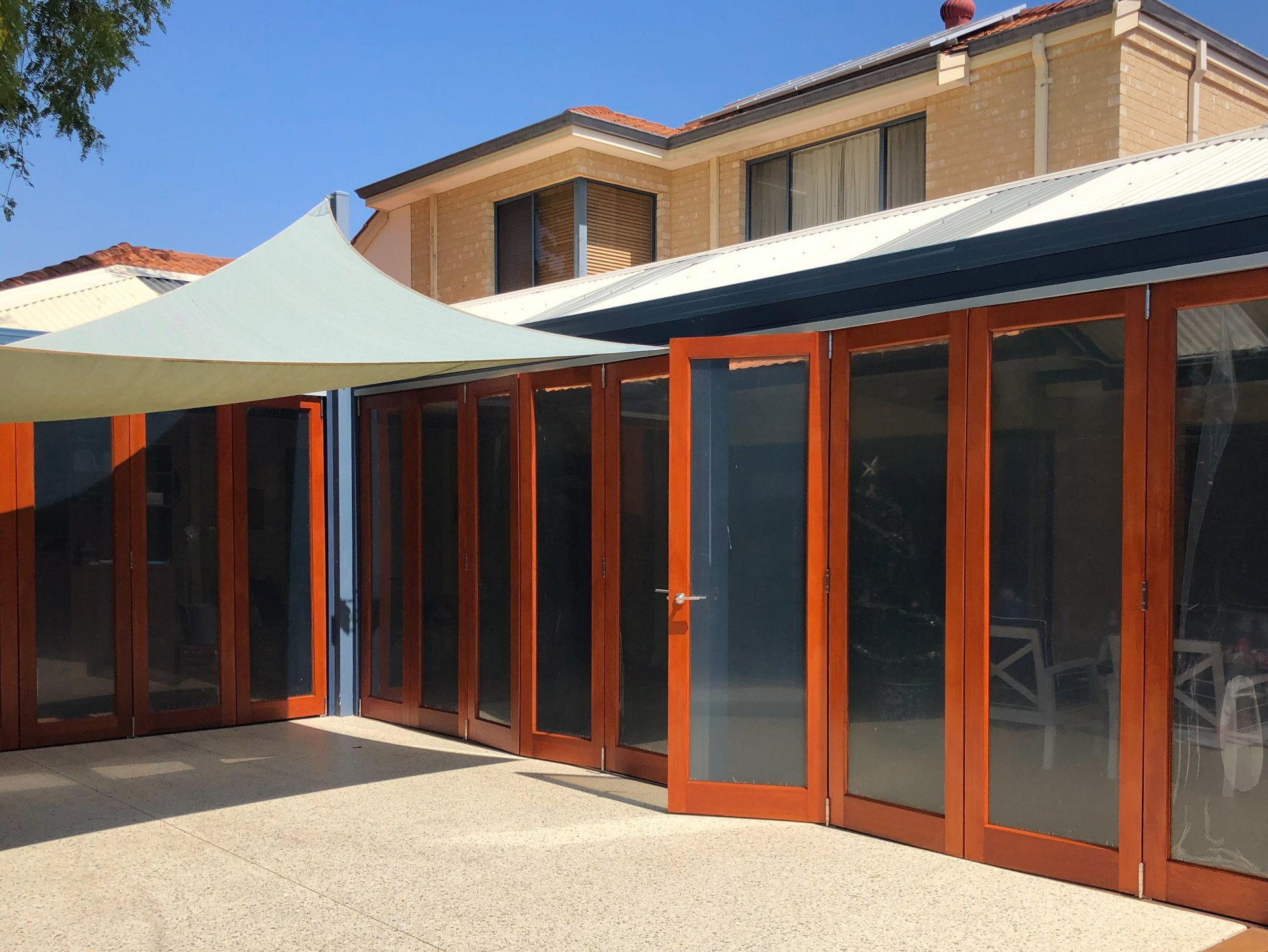 residential patio bi-fold doors with freash coat of varnish