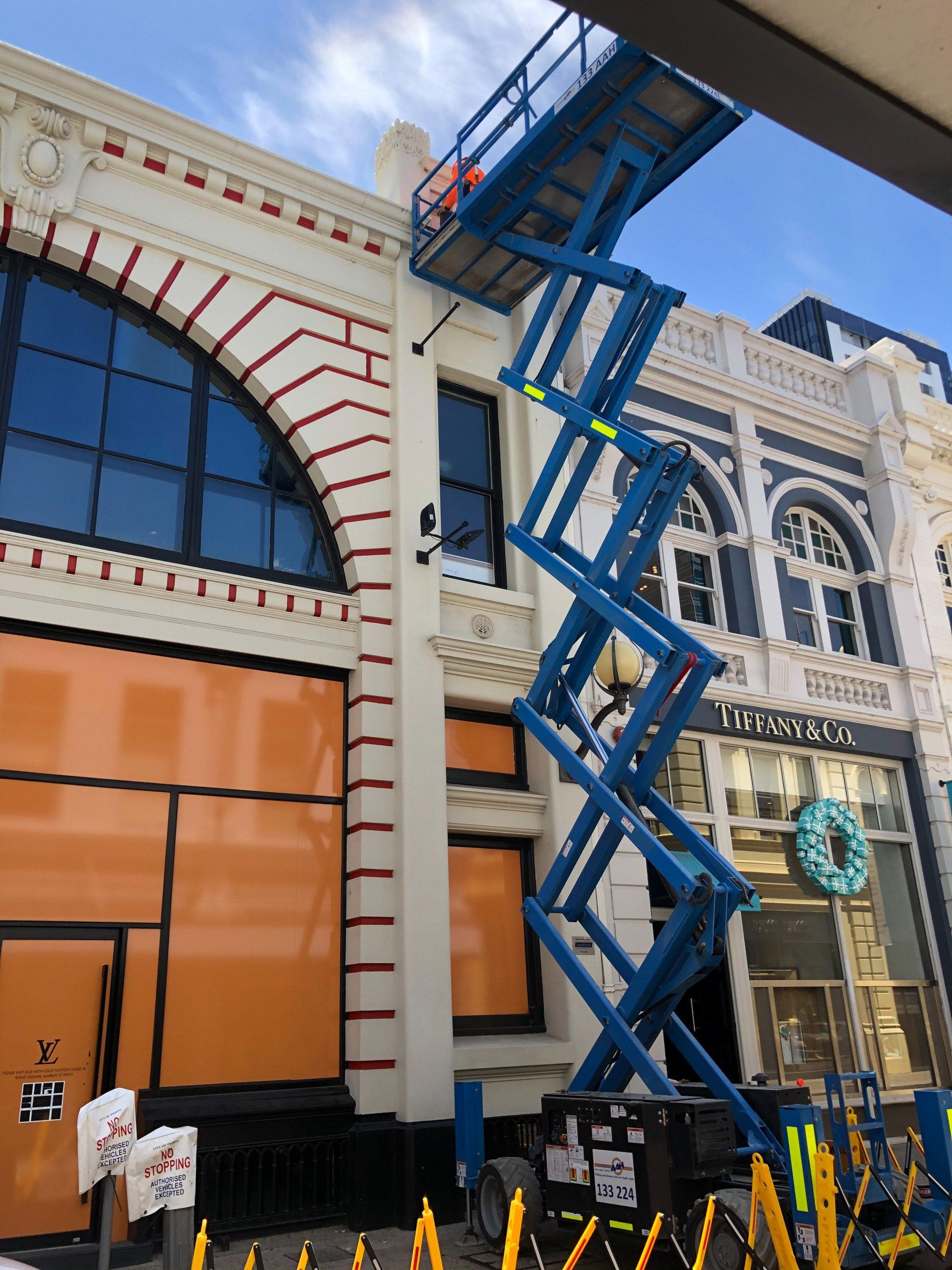 cherry picker used by ABC Paint & Deco to paint the front of Tiffany & Co perth CBD