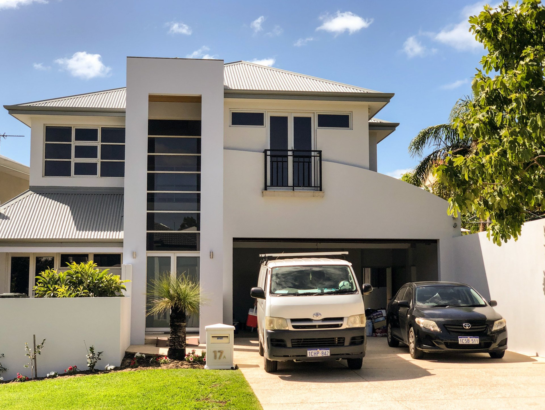 Two story white perth home with ABC Paint & Deco van outside