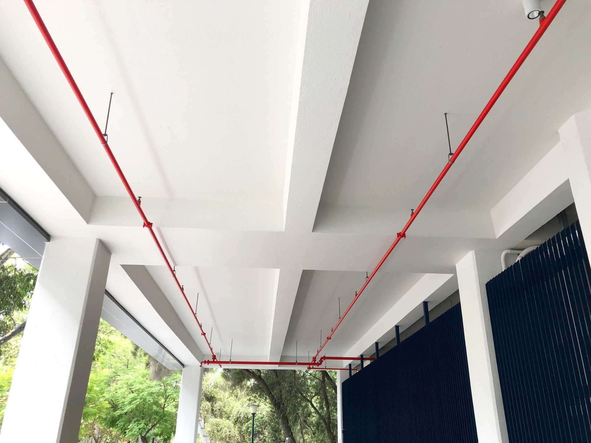 red fire sprinkler system painted by ABC Paint & Deco