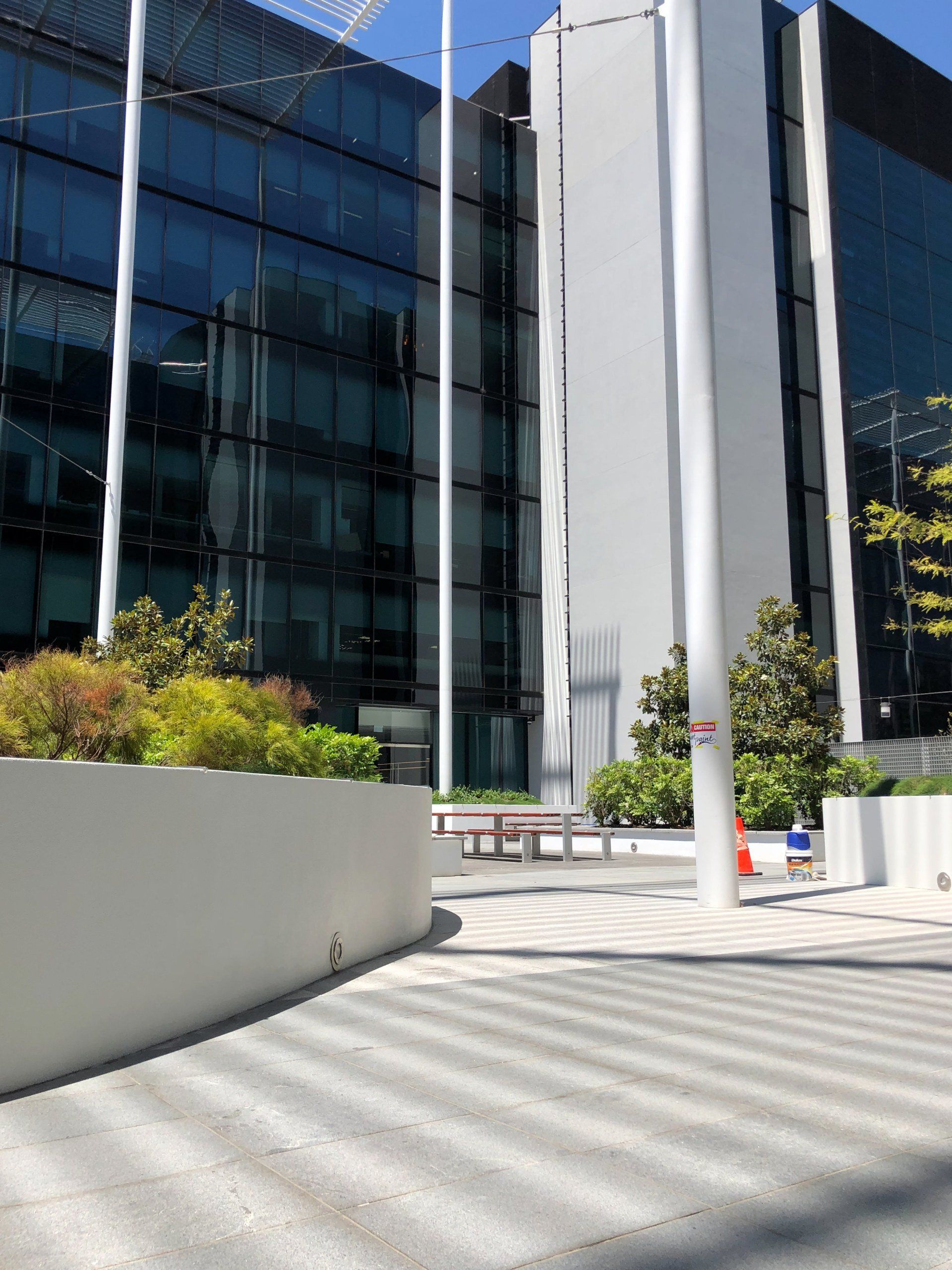 white flower bed walls painted by ABC Paint & Deco painter