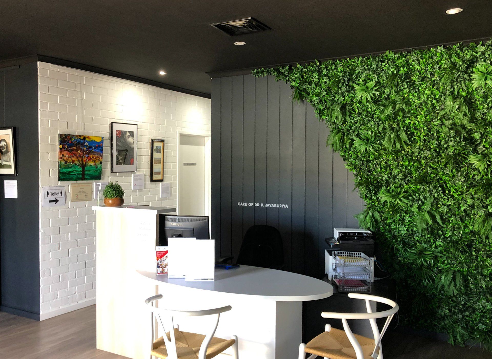 black and white walls of a doctors reception area painted by ABC Paint & Deco
