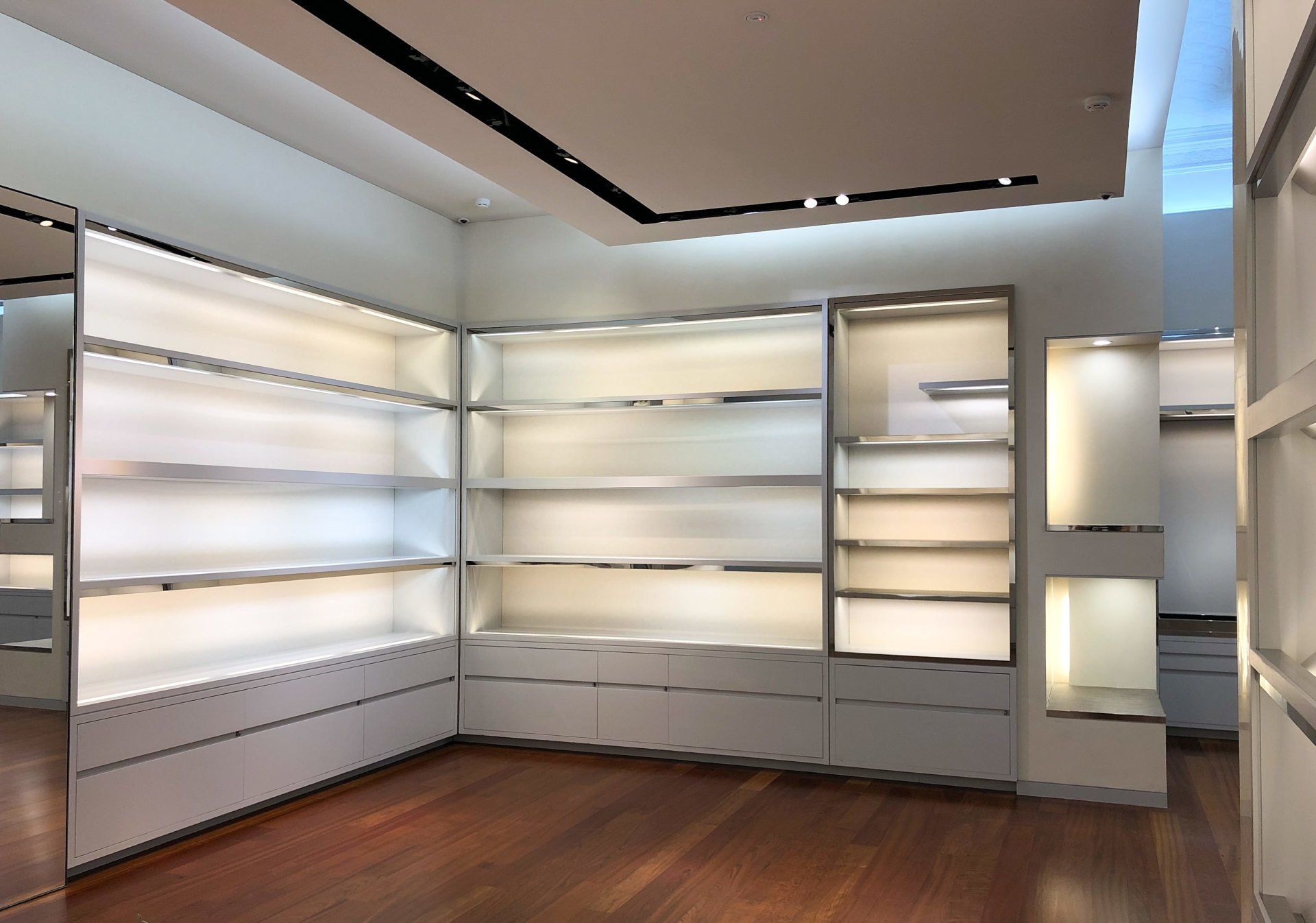 back lighted retail shop shelving painted by ABC Paint & Deco