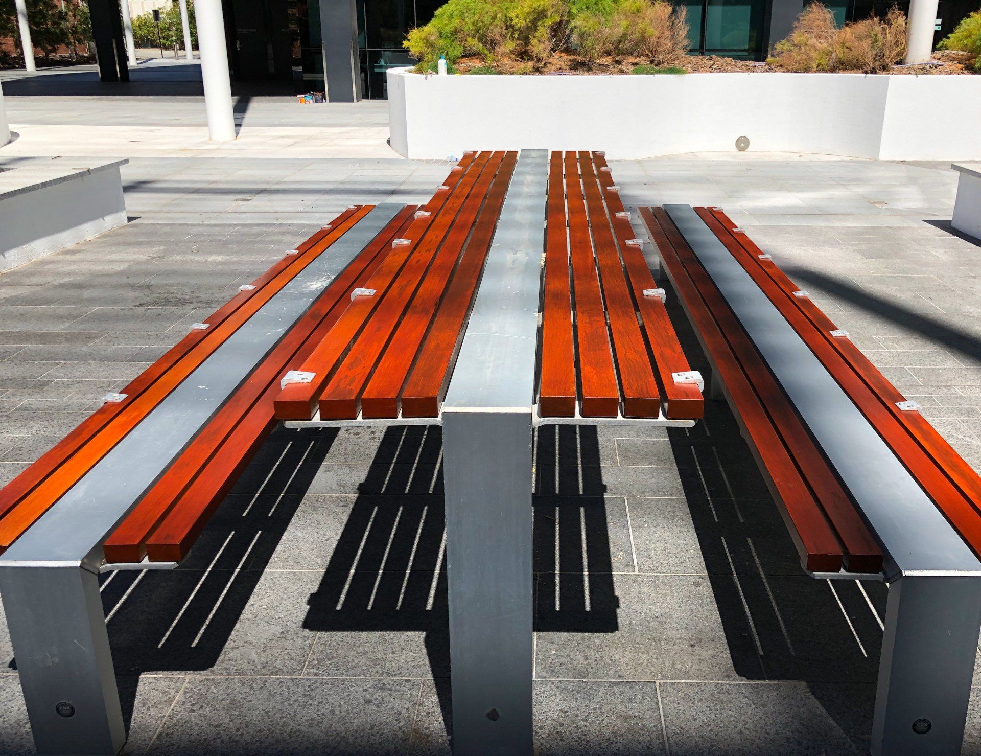 public wooden and metal bench painted by ABC Paint & Deco