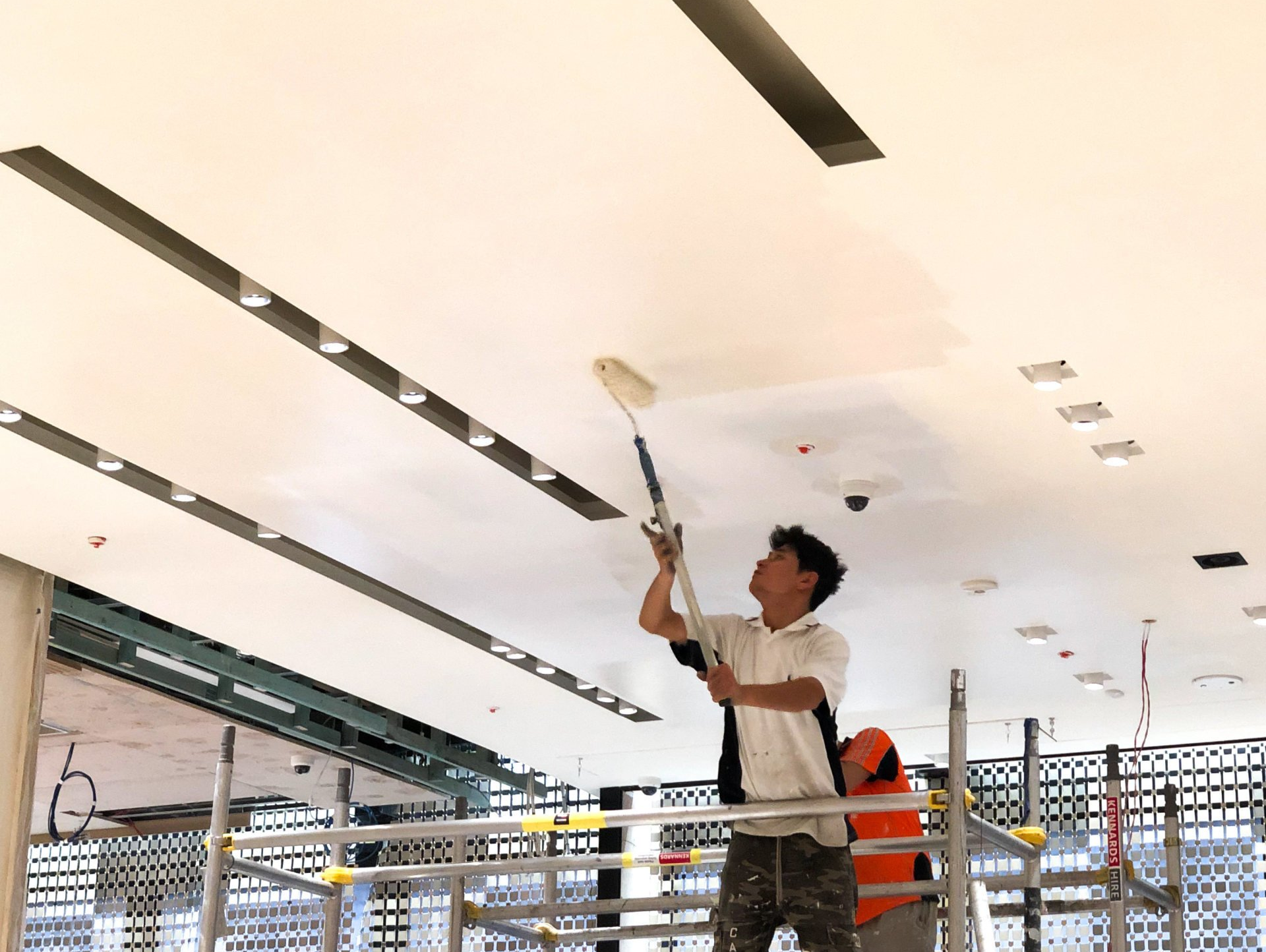 ABC Paint & Deco painters painting retail shop ceiling